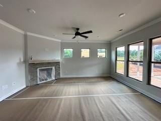 5444 Miravista Way, Hoschton, GA 30548 - unfurnished living room featuring ornamental molding, ceiling fan, and a fireplace