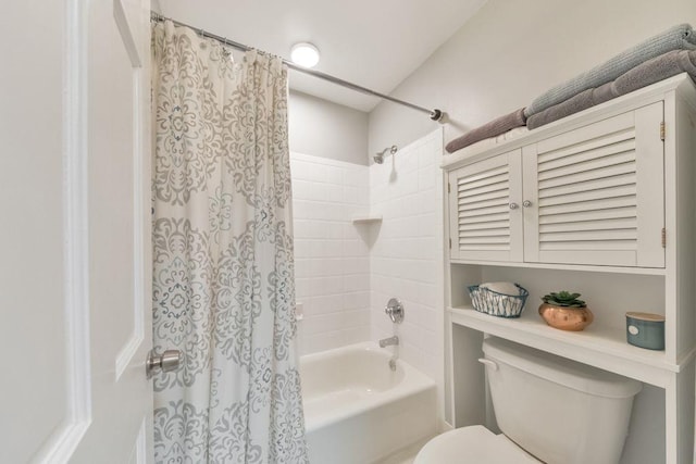 bathroom featuring toilet and shower / bathtub combination with curtain