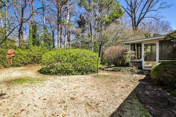 view of yard featuring a sunroom