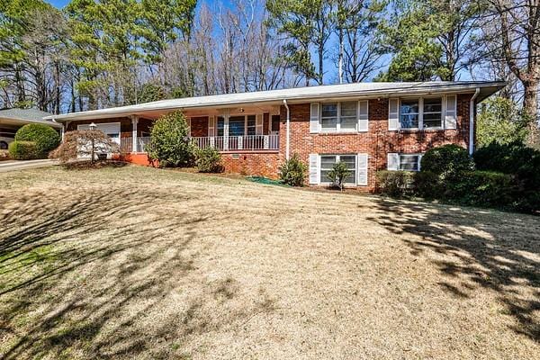 view of front of home featuring brick siding