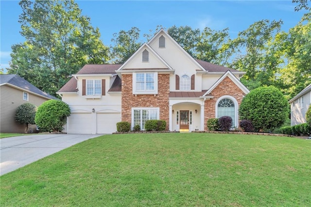 4360 Canterbury Walk Dr, Duluth, GA 30097 - traditional-style home with stone siding, stucco siding, concrete driveway, a garage, and a front yard