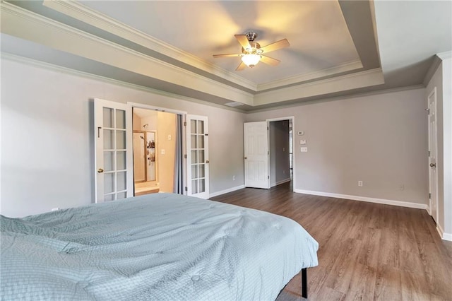4360 Canterbury Walk Dr, Duluth, GA 30097 - bedroom with a tray ceiling, wood finished floors, ornamental molding, baseboards, and french doors