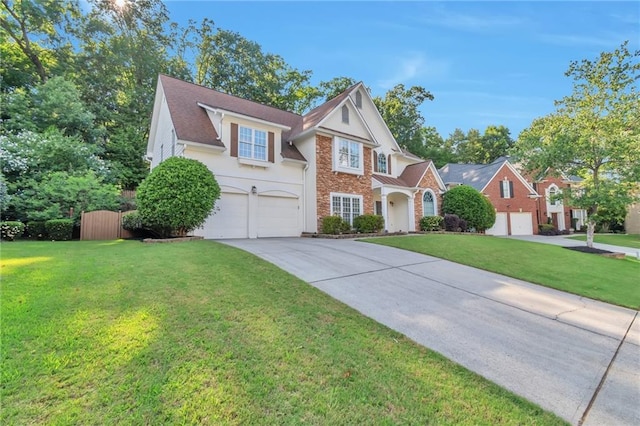 4360 Canterbury Walk Dr, Duluth, GA 30097 - view of front of property with a garage, concrete driveway, a front lawn, stucco siding, and stone siding