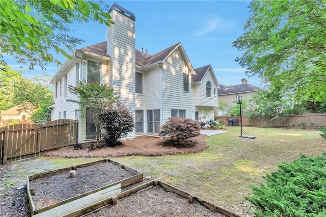 4360 Canterbury Walk Dr, Duluth, GA 30097 - rear view of house featuring a chimney, a garden, and a patio area