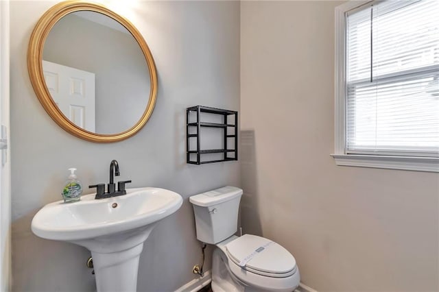 4360 Canterbury Walk Dr, Duluth, GA 30097 - bathroom with toilet, baseboards, and a sink