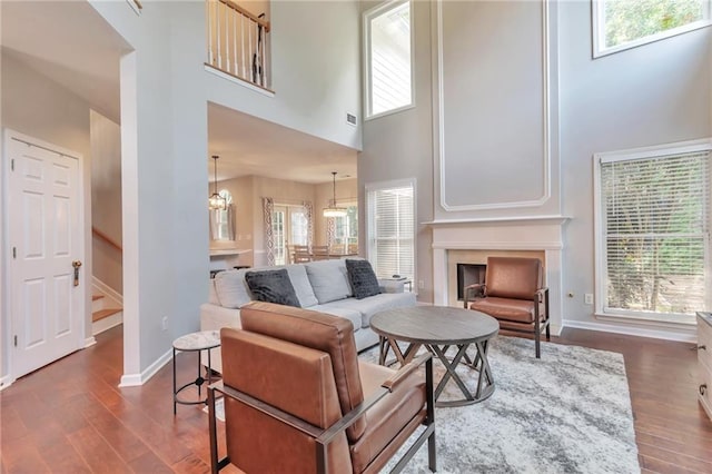4360 Canterbury Walk Dr, Duluth, GA 30097 - living room with a high ceiling, dark wood-style flooring, stairs, and plenty of natural light