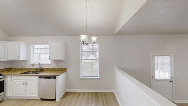 kitchen with white cabinets, light wood-style floors, appliances with stainless steel finishes, and a sink