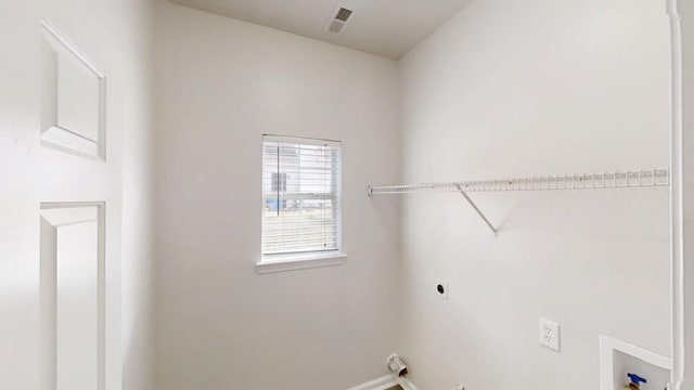 laundry area with washer hookup, laundry area, visible vents, and electric dryer hookup