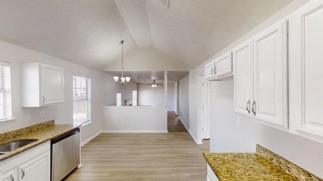 kitchen featuring light stone countertops, stainless steel dishwasher, light wood-style flooring, and white cabinetry