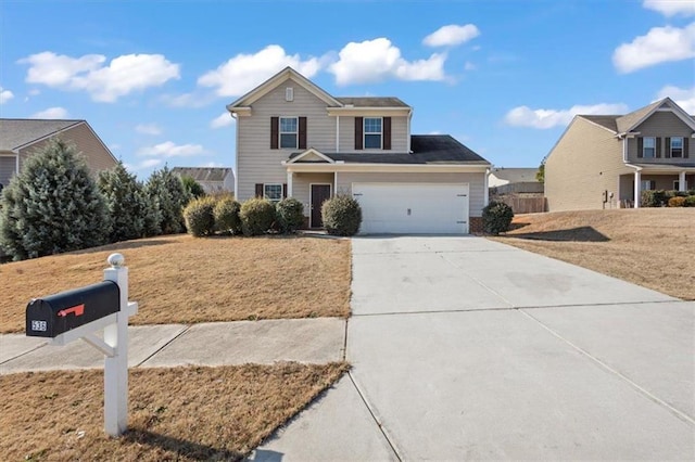 traditional home featuring a front lawn, an attached garage, and concrete driveway