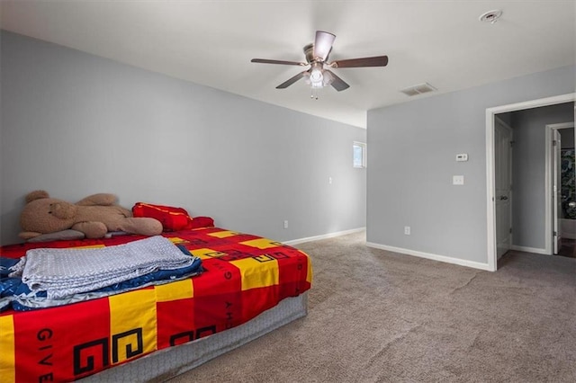 bedroom with baseboards, carpet flooring, visible vents, and a ceiling fan