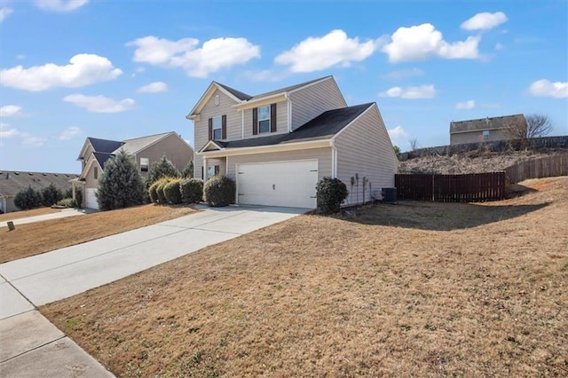 traditional home with driveway, fence, a front lawn, a garage, and central AC