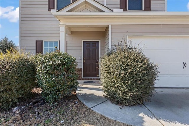 view of exterior entry featuring a garage