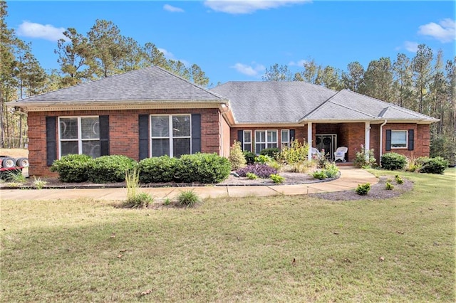 ranch-style house with a front lawn