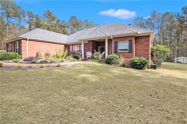 ranch-style house featuring a front lawn