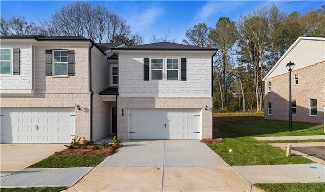 view of front facade featuring a garage, a front yard, brick siding, and driveway