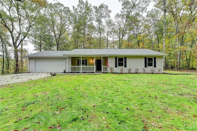 single story home featuring a porch, a garage, and a front lawn