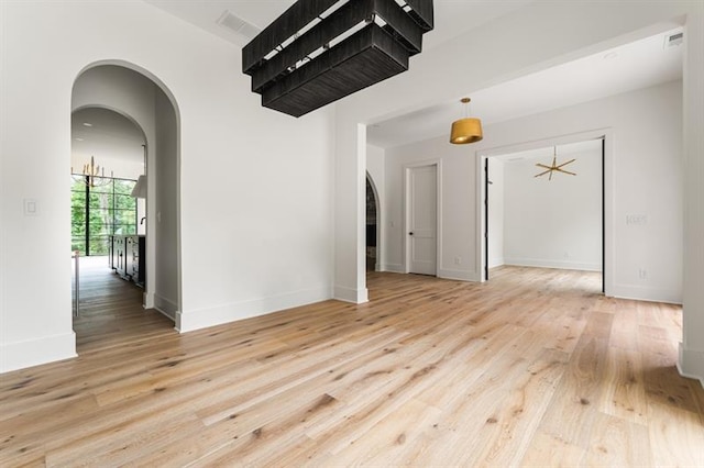 spare room with light hardwood / wood-style floors and ceiling fan