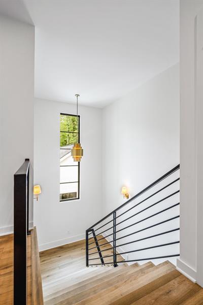 stairway with hardwood / wood-style floors