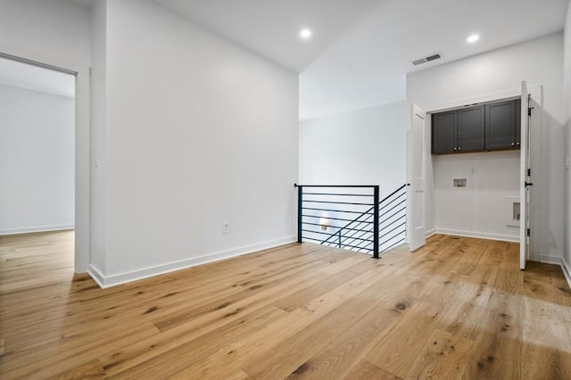 spare room featuring light hardwood / wood-style floors