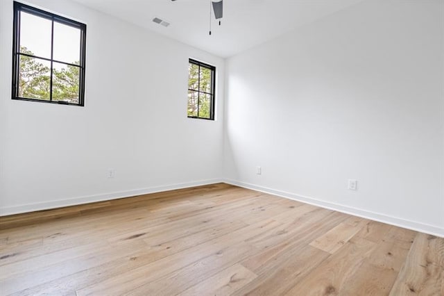 unfurnished room featuring ceiling fan and light hardwood / wood-style floors