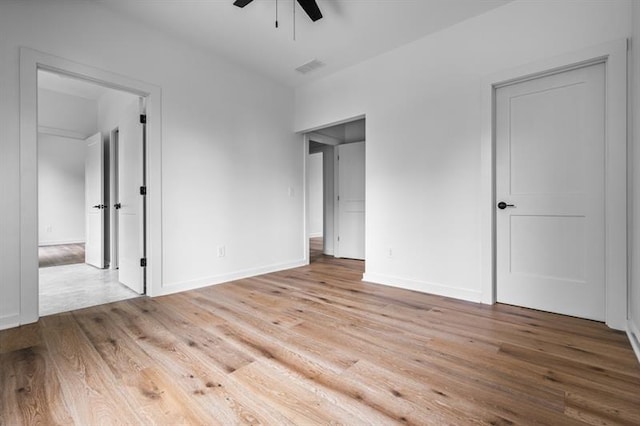 unfurnished bedroom featuring ceiling fan and light wood-type flooring