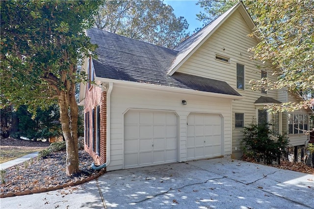 view of side of property with a garage