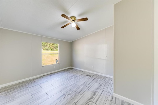 empty room featuring ornamental molding and ceiling fan