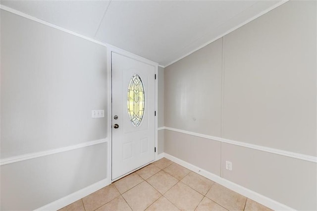 tiled entryway with ornamental molding