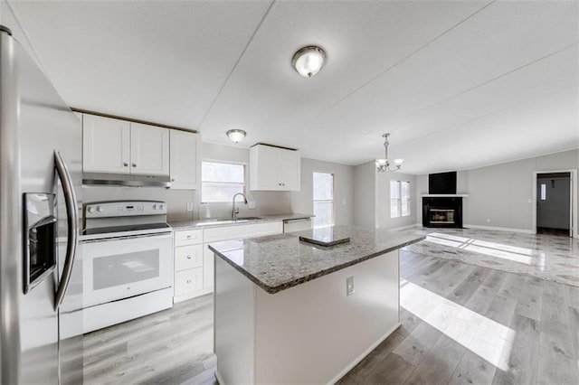 kitchen featuring white cabinetry, white electric stove, a fireplace, light hardwood / wood-style floors, and stainless steel refrigerator with ice dispenser