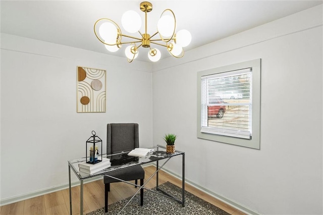 home office featuring hardwood / wood-style floors and a chandelier