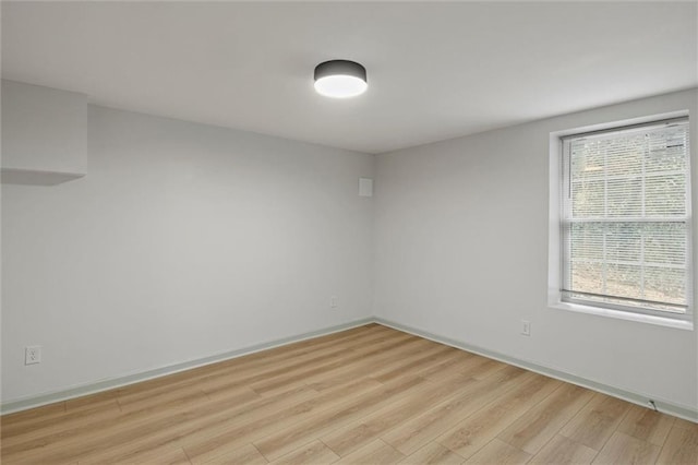 empty room with light hardwood / wood-style floors