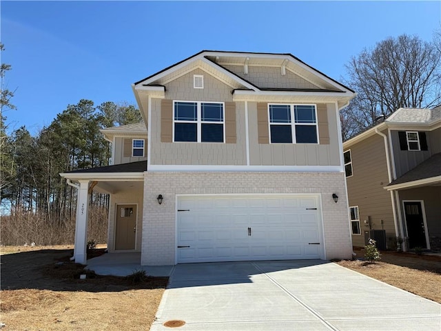 view of front of home with brick siding, concrete driveway, and a garage