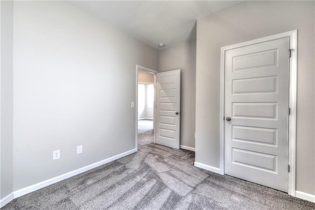 unfurnished bedroom featuring light colored carpet