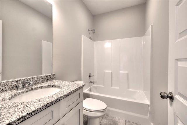 full bathroom featuring tile patterned flooring, vanity, bathing tub / shower combination, and toilet