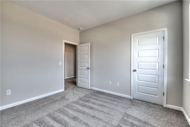 unfurnished bedroom with light colored carpet