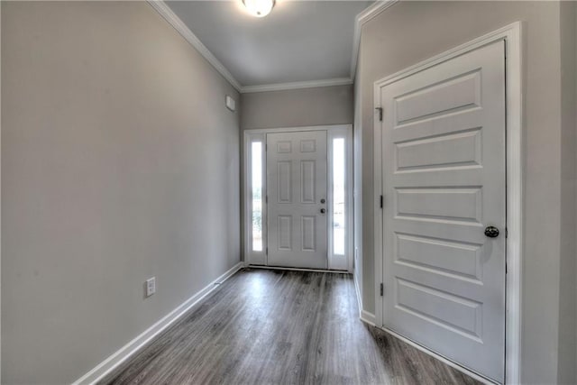 foyer entrance with dark wood-type flooring and crown molding