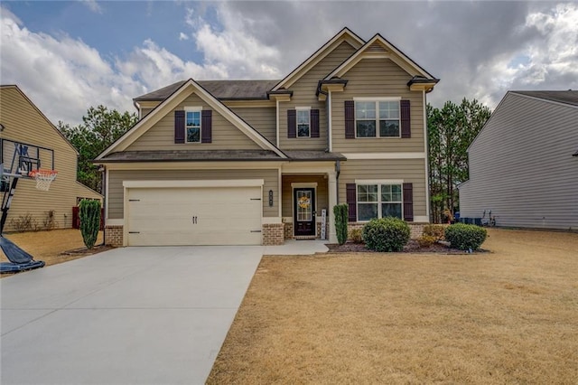 craftsman-style home with concrete driveway, brick siding, and a front lawn