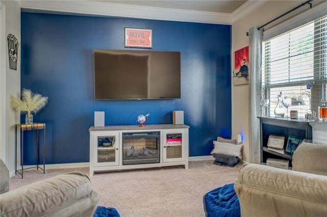 carpeted living area with ornamental molding and baseboards