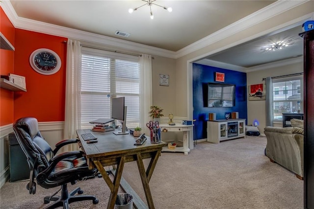 office space with a wainscoted wall, carpet, visible vents, and crown molding