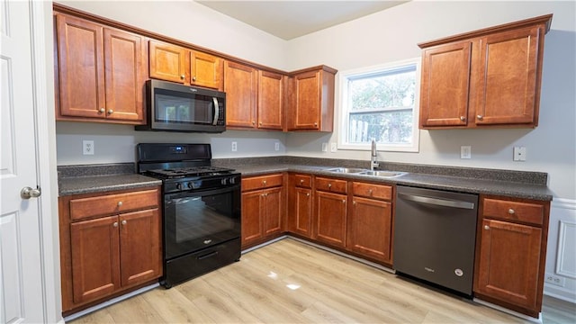 3176 Creston Park Ct, Duluth, GA 30096 - kitchen with stainless steel appliances, dark countertops, light wood finished floors, and brown cabinetry