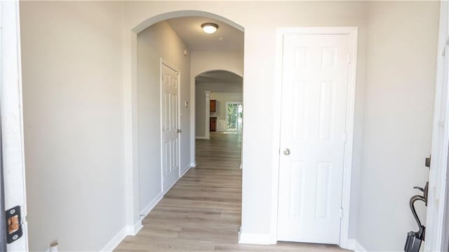 3176 Creston Park Ct, Duluth, GA 30096 - corridor featuring arched walkways and light wood finished floors