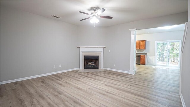 3176 Creston Park Ct, Duluth, GA 30096 - unfurnished living room with a ceiling fan, light wood-style flooring, and a fireplace with raised hearth