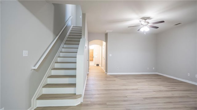 3176 Creston Park Ct, Duluth, GA 30096 - staircase featuring arched walkways, ceiling fan, and wood finished floors