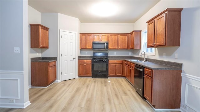 3176 Creston Park Ct, Duluth, GA 30096 - kitchen with black gas range, stainless steel microwave, dishwashing machine, and light wood-type flooring