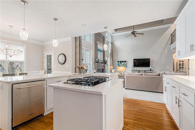 kitchen with white cabinetry, a kitchen island, dishwasher, and black gas stovetop