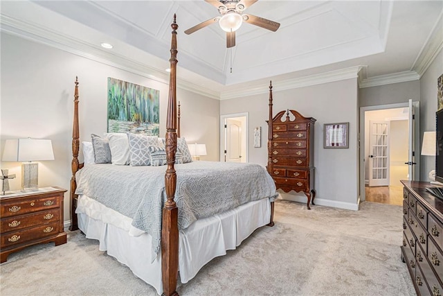 carpeted bedroom with ornamental molding, a raised ceiling, and ceiling fan