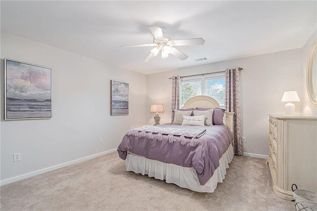 bedroom featuring light carpet and ceiling fan