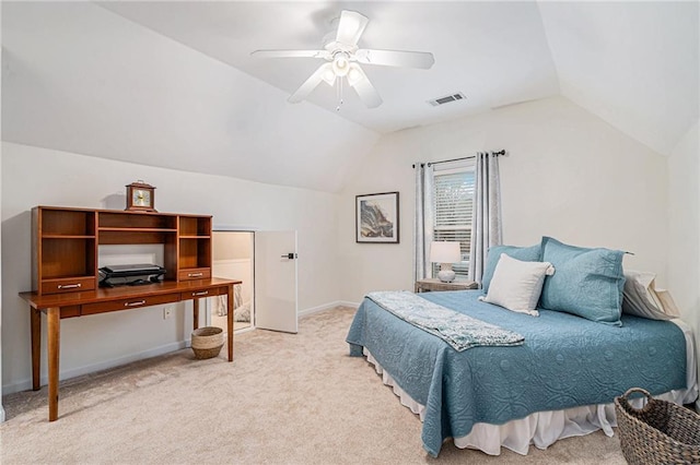 bedroom with light carpet, vaulted ceiling, and ceiling fan