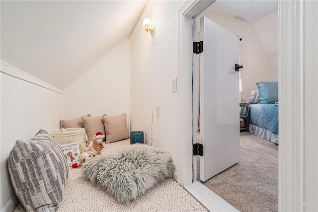 carpeted bedroom featuring lofted ceiling